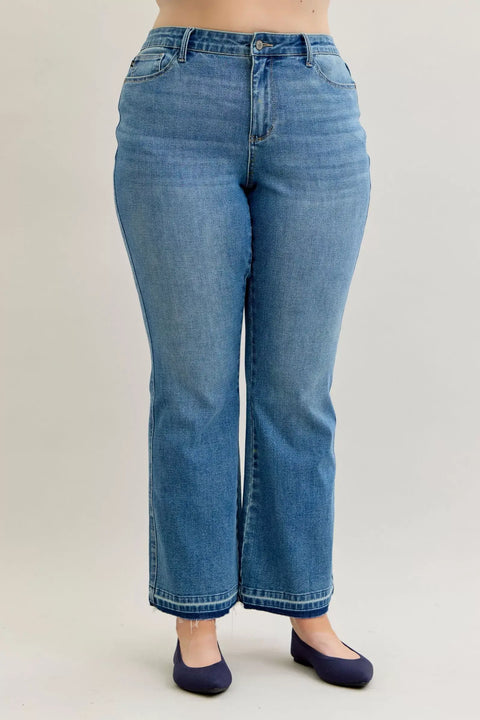 Judy Blue High-Waist Straight Leg Jeans – Tummy Control shown in a model, featuring a flattering fit and classic blue denim.