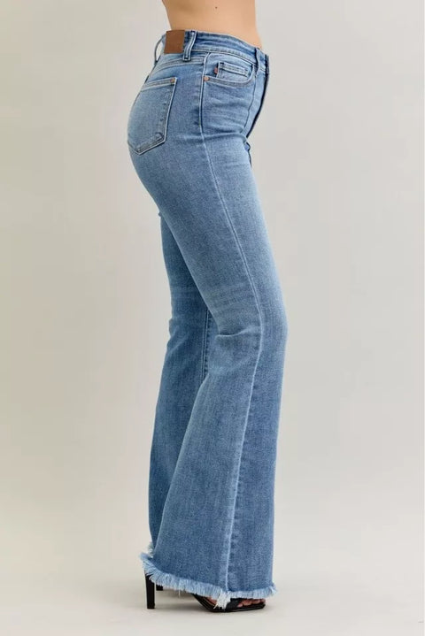 Judy Blue High Waist Flare Fray Hem Jeans with Pintuck Detail side view showcasing flattering high waist and retro flare.