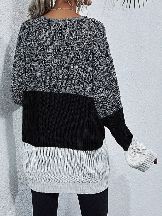 Color Block Round Neck Oversized Sweater featuring a cozy, oversized fit and stylish black, gray, and white color blocking.