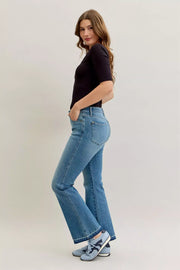 Judy Blue High-Waist Straight Leg Jeans – Tummy Control worn by a model with a casual outfit.
