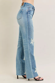 Judy Blue Plus Size High Waist Magic Star Destroy 90’s Straight Jeans shown on model from the side, featuring star details and a straight leg.