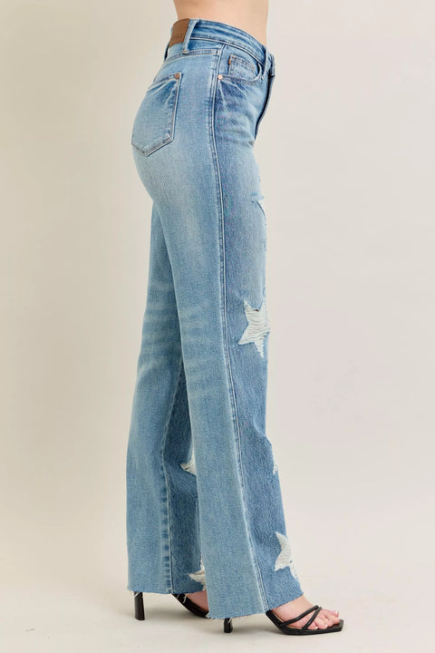 Judy Blue Plus Size High Waist Magic Star Destroy 90’s Straight Jeans shown on model from the side, featuring star details and a straight leg.