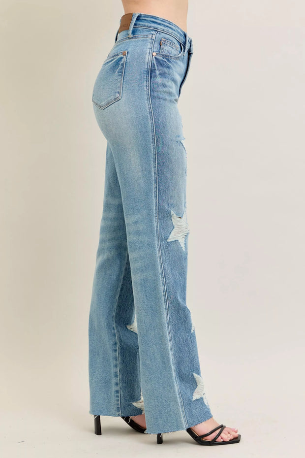 Judy Blue Plus Size High Waist Magic Star Destroy 90’s Straight Jeans shown on model from the side, featuring star details and a straight leg.