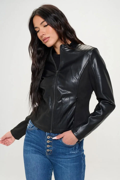 Model posing in Coalition LA vegan moto jacket and jeans – classic moto style with modern fit