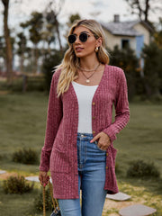 Ribbed Button-Up Cardigan with Pockets worn by a model outdoors, featuring a heathered texture and casual style.