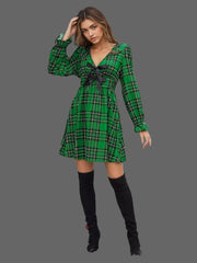 Plaid Holiday Mini Dress – Smocked & Ruffled, featuring a smocked waist and bow-tie front.