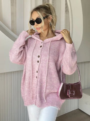 Drawstring Button Down Hooded Cardigan in pink, featuring buttons, drawstring, and pockets, styled with sunglasses and a handbag.