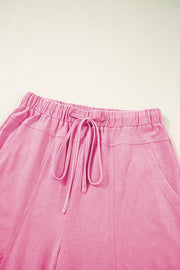 Mineral Wash Reverse Seam Drawstring Elastic Waist pink cargo pants with adjustable waistband and pockets.