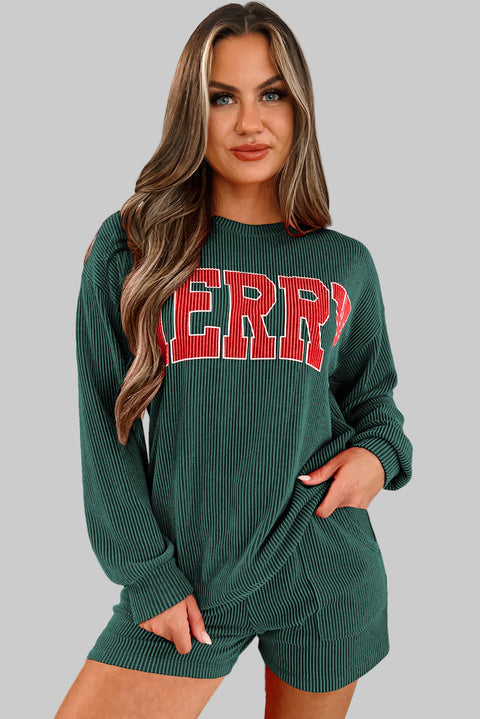 Evergreen MERRY Corded Lounge Set featuring a model with a bold 'MERRY' graphic in a cozy setting.