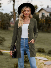 Woman wearing a Ribbed Button-Up Cardigan with Pockets, styled with jeans and accessories in a scenic outdoor setting.