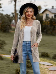 Ribbed Button-Up Cardigan with Pockets styled with a white top and worn by a woman in a hat outdoors.