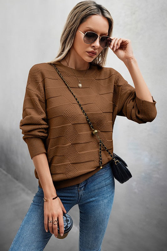 Classic Round Neck Loose Knit Sweater styled with jeans and accessories for a casual look.