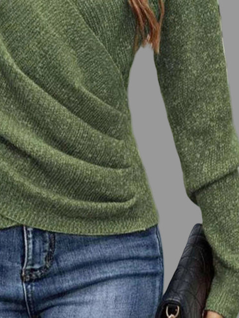 Close-up of a woman wearing a Surplice Long Sleeve Knit Top in green with ribbed detailing and a stylish silhouette.