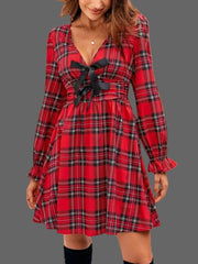 Plaid Holiday Mini Dress – Smocked & Ruffled featuring a bow-tie front and ruffled hem for a festive look.