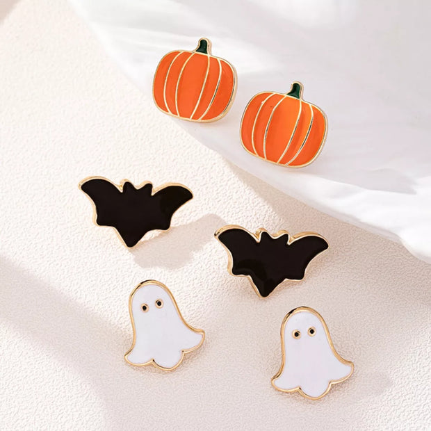 3-Pair Halloween Stud Earring Set with pumpkin, bat, and ghost designs on a stylish display.
