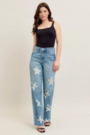 Judy Blue Plus Size High Waist Magic Star Destroy 90’s Straight Jeans with star details and raw hems on model