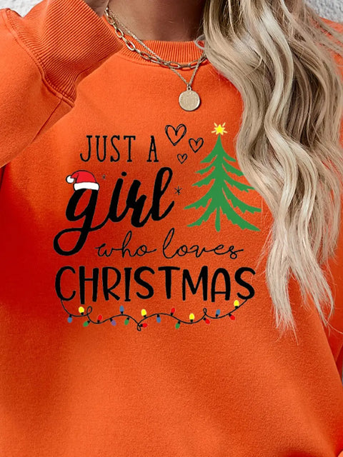 Just a girl who loves Christmas Letter Graphic Round Neck Sweatshirt  on orange sweatshirt, perfect for festive casual wear.