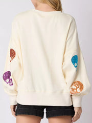 Halloween Colorful Skull Sequin Oversized Sweatshirt with colorful sequin skulls on sleeves.