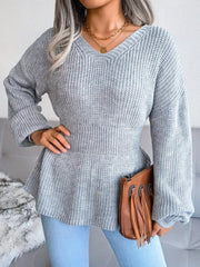 V-Neck Dropped Shoulder Sweater in gray with ribbed peplum design, styled with jeans and a brown bag.