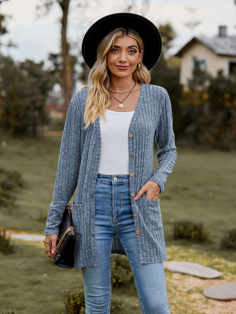 Ribbed Button-Up Cardigan with Pockets worn by a woman outdoors, styled with jeans and a hat.