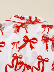 Buttoned Two-Piece Set featuring red bow design on a white background, showcasing a stylish and chic pattern.
