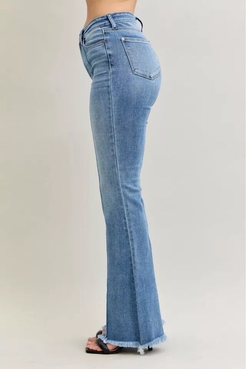 Judy Blue High Waist Flare Fray Hem Jeans with Pintuck Detail showcased from the side, highlighting the flare leg and frayed hem.