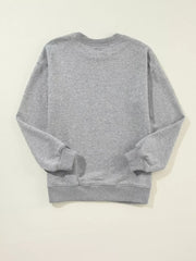 Back view of gray Merry Christmas Letter Sweatshirt showing soft fabric and relaxed drop-shoulder fit