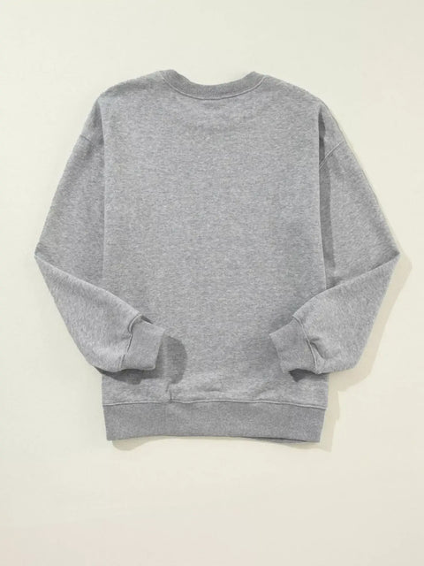 Back view of gray Merry Christmas Letter Sweatshirt showing soft fabric and relaxed drop-shoulder fit