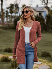 Ribbed Button-Up Cardigan with Pockets styled casually outdoors, features v-neck and long sleeves.