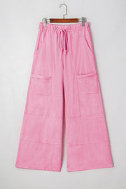 Mineral Wash Reverse Seam Drawstring Elastic Waist cargo pants in vibrant pink with functional pockets.