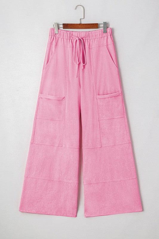 Mineral Wash Reverse Seam Drawstring Elastic Waist cargo pants in vibrant pink with functional pockets.