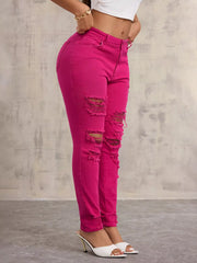High-Waisted Distressed Skinny Jeans – Classic Denim Fit in vibrant pink with distressed details and a flattering fit.