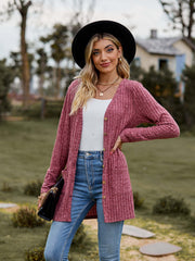 Ribbed Button-Up Cardigan with Pockets worn by a model in a casual outdoor setting with a wide-brim hat.