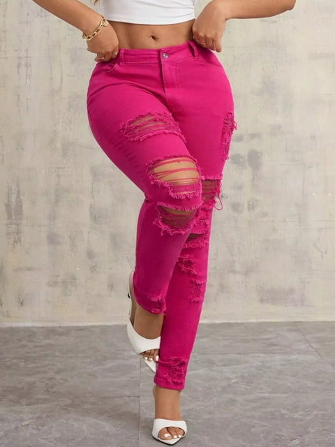 High-Waisted Distressed Skinny Jeans – Classic Denim Fit in vibrant pink with ripped details and a trendy fit.