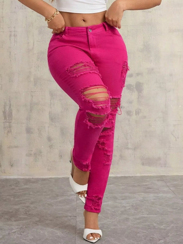 High-Waisted Distressed Skinny Jeans – Classic Denim Fit in vibrant pink with ripped details and a trendy fit.