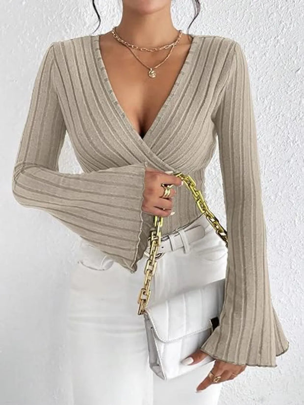 Ribbed Flare Sleeve Top – Slim Fit Knit in beige with statement sleeves and a fitted design paired with white jeans.