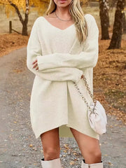 V-Neck Dropped Shoulder Sweater Dress – Cozy Knit Style worn by model in fall setting with boots and purse.