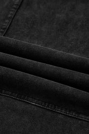 Close-up of the fabric detail of Mineral Wash Reverse Seam Drawstring Elastic Waist cargo pants in black.
