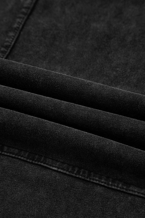 Close-up of the fabric detail of Mineral Wash Reverse Seam Drawstring Elastic Waist cargo pants in black.