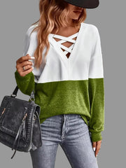 Crisscross V-Neck Color Block Top in white and green with crisscross neckline, styled casually with a handbag.