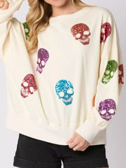 Halloween Colorful Skull Sequin Oversized Sweatshirt with multicolored sequined skulls on a light background.