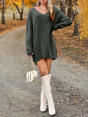 V-Neck Dropped Shoulder Sweater Dress – Cozy Knit Style worn with knee-high boots on a scenic fall pathway.